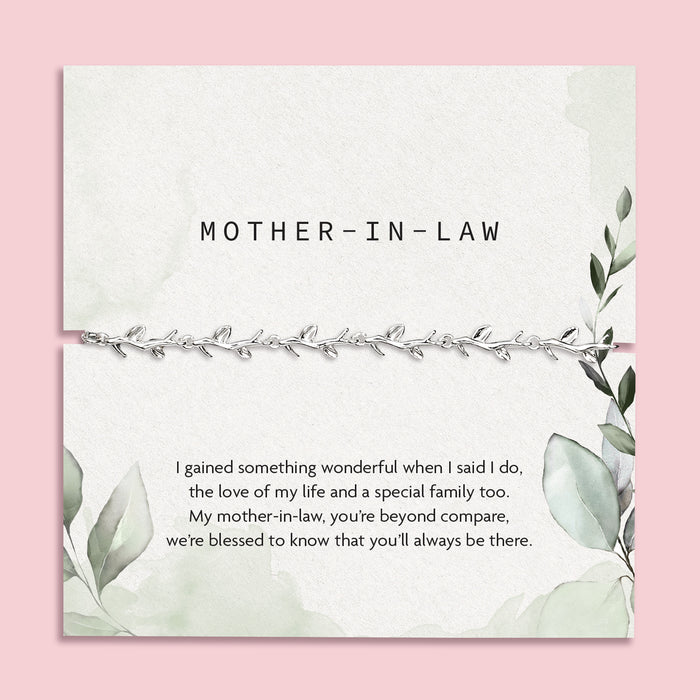 pink background with mother in law poem card with green design and silver-plated vine bracelet
