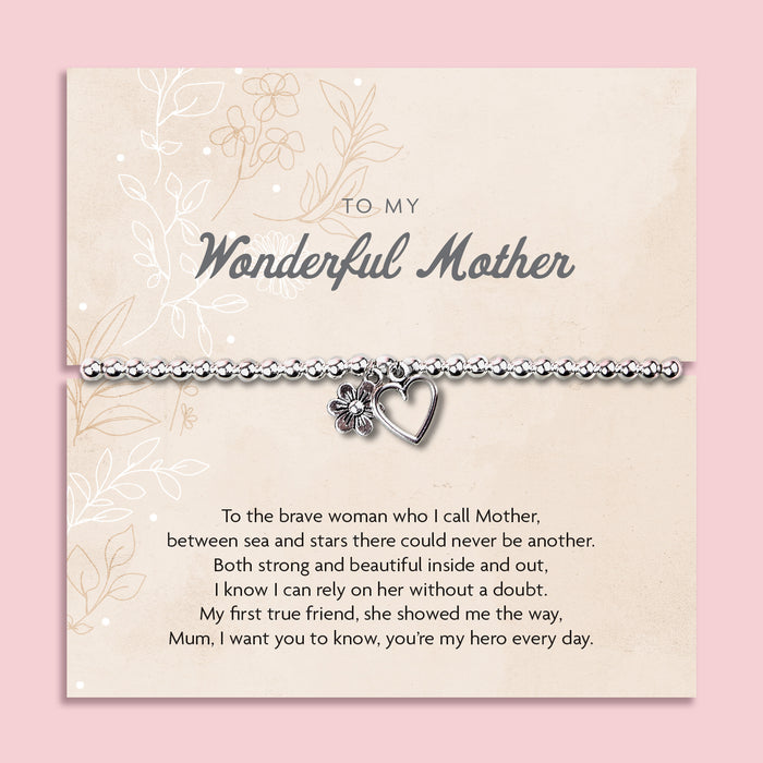 A silver beaded bracelet with a heart and flower charm displayed on a card reading "To my Wonderful Mother" from Letterbox Love, set against a soft pink background. The card features a heartfelt poem, making it a perfect sentimental gift for a mother