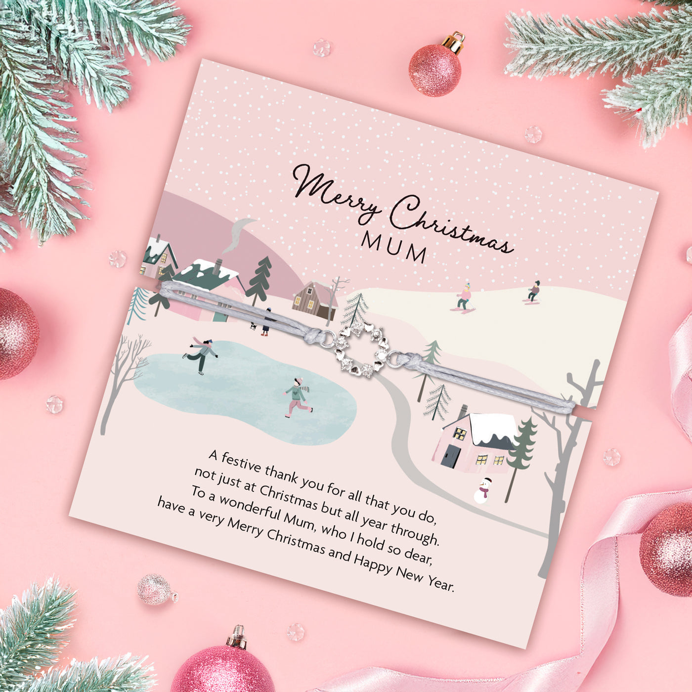 Christmas card for Mum with festive design and text on a pink background with Christmas decorations. Wreath bracelet gift for Mum.