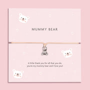 A soft pink bracelet card with a cute teddy bear charm, featuring the text "MUMMY BEAR" and a heartfelt message, "A little thank you for all that you do, you're my mummy bear and I love you!" surrounded by adorable bear illustrations.