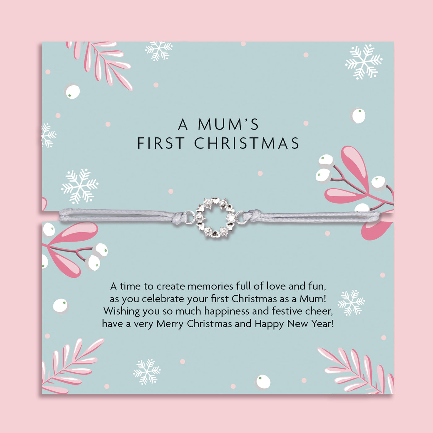 Delicate silver charm bracelet on a festive card, a sentimental gift celebrating a mum’s first Christmas.