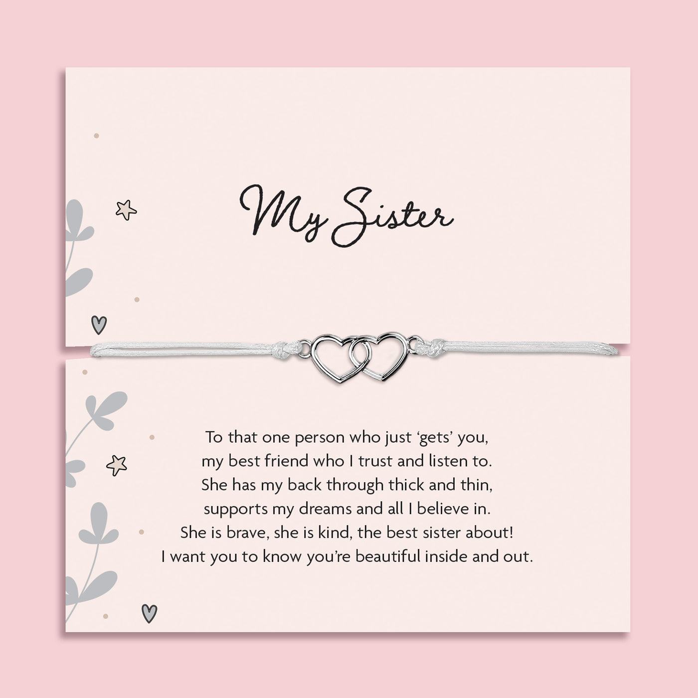 My Sister bracelet featuring two silver interlocking heart charms on an adjustable cord, presented on a blush pink card with a heartfelt message about sisterhood. Wrapped in pink tissue paper, ready for gifting. A sentimental jewellery gift for sisters, perfect for birthdays, Christmas, or just to show appreciation. A meaningful bracelet symbolising love, friendship, and connection between sisters.