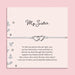 My Sister bracelet featuring two silver interlocking heart charms on an adjustable cord, presented on a blush pink card with a heartfelt message about sisterhood. Wrapped in pink tissue paper, ready for gifting. A sentimental jewellery gift for sisters, perfect for birthdays, Christmas, or just to show appreciation. A meaningful bracelet symbolising love, friendship, and connection between sisters.