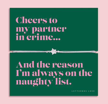 Partner in Crime Christmas bracelet featuring a sparkling cubic zirconia star charm on an adjustable cord, presented on a bold green card with the fun message “Cheers to my partner in crime… and the reason I’m always on the naughty list.” Arrives beautifully gift wrapped. A playful and thoughtful Christmas jewellery gift for friends, perfect as a stocking filler, Secret Santa surprise, or festive keepsake for your bestie.