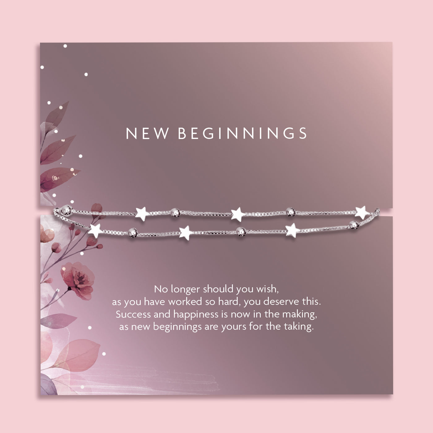 Flat lay of a “New Beginnings” bracelet gift by Letterbox Love, featuring a double silver box chain with star and bead charms, displayed on a mauve-toned sentiment card with floral illustrations and an inspiring message.