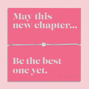 Friendship bracelet with a silver star charm on an adjustable cord, displayed on a pink card reading “May this new chapter… be the best one yet” — an uplifting bracelet for a friend and thoughtful friendship gift by Letterbox Love.