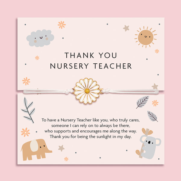 White adjustable cord bracelet with a gold and white enamel daisy charm, displayed on a soft pink thank you card that reads 'Thank You Nursery Teacher'. Surrounded by cute illustrations of a sun, cloud, elephant, and koala, with a heartfelt poem. A thoughtful end-of-term gift by Letterbox Love.
