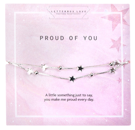 Pink-themed bracelet card featuring a delicate silver star and bead design on a double-layered chain. The card has a soft pastel background with subtle star patterns, accompanied by the text 'Proud of You' and a heartfelt message expressing pride and admiration. 