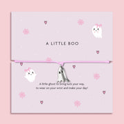 Adjustable pink cord Halloween bracelet with delicate silver ghost pendant, displayed on a pastel card with cute ghost, heart, and cobweb illustrations. Perfect spooky-season jewellery gift, trick-or-treat favour, or Halloween present for adults and older children.