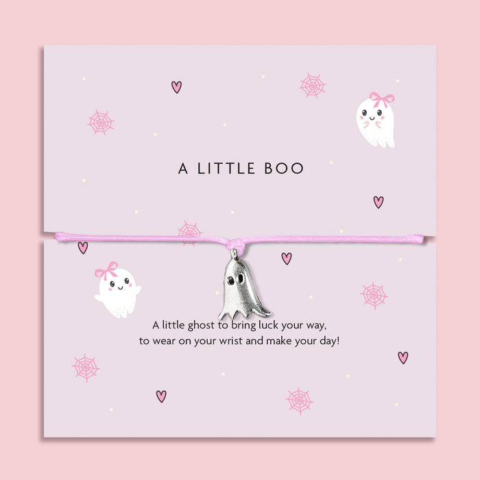 Adjustable pink cord Halloween bracelet with delicate silver ghost pendant, displayed on a pastel card with cute ghost, heart, and cobweb illustrations. Perfect spooky-season jewellery gift, trick-or-treat favour, or Halloween present for adults and older children.