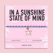 Colourful waterproof anklet duo featuring pink and turquoise woven cords with a white starfish charm on a pink "In A Sunshine State Of Mind" gift card. Perfect summer beach jewellery and holiday accessory.
