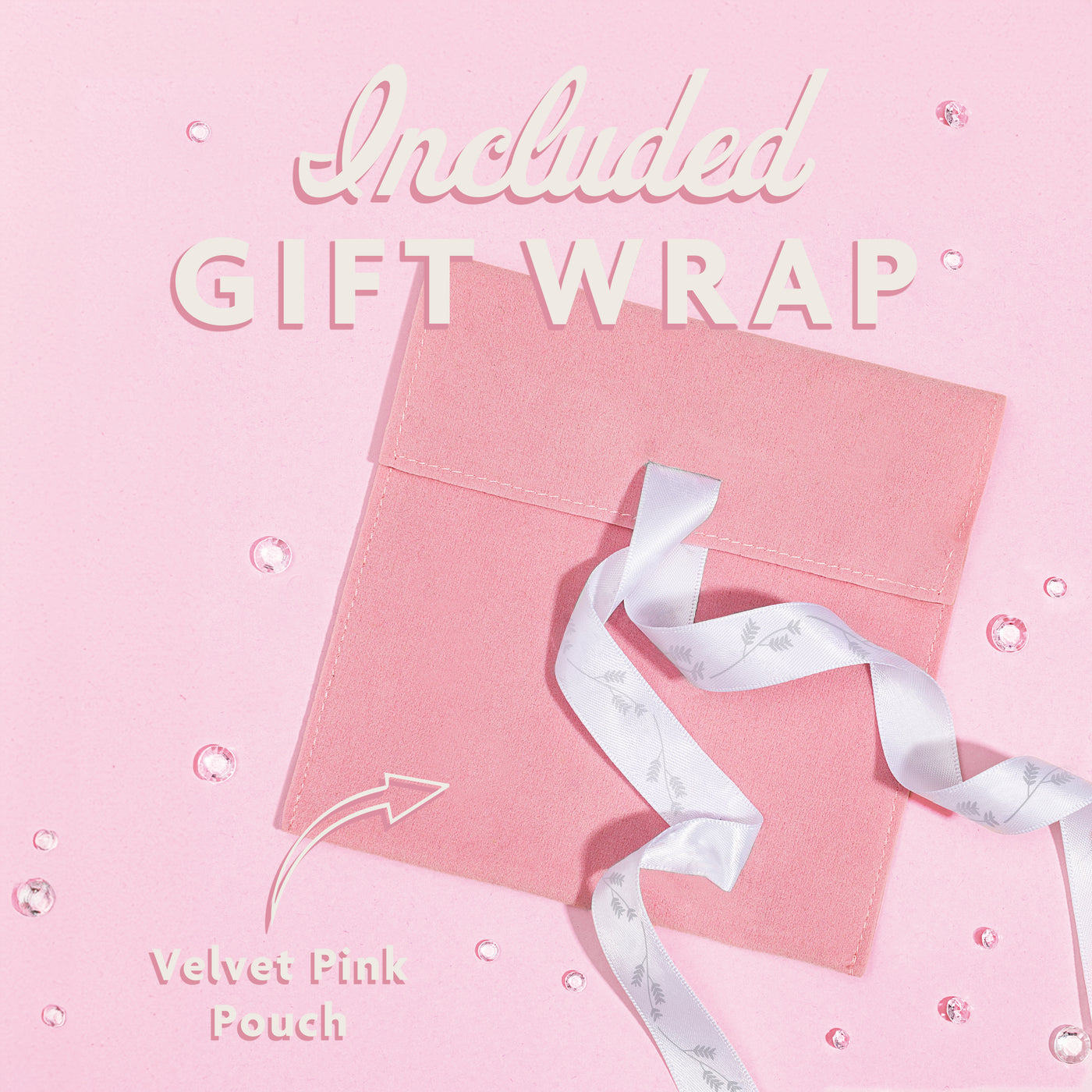 A pink background with a velvet pink pouch and white ribbon, included gift wrap on a jewellery gift for her
