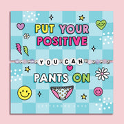 Blue chequered poem card with the bold text saying "Put your positive pants on", with a beaded bracelet spelling the words "You Can". An ideal gift for a best friend.