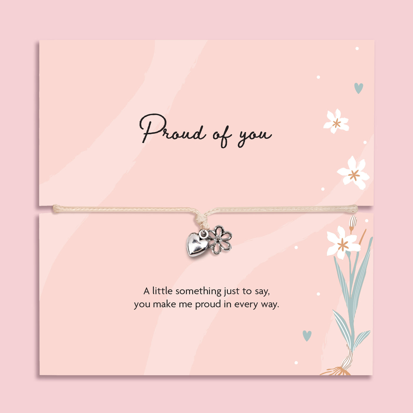 Proud of you bracelet with heart and flower charm on adjustable cord, displayed on pink sentiment card with message, encouragement gift