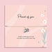 Proud of you bracelet with heart and flower charm on adjustable cord, displayed on pink sentiment card with message, encouragement gift