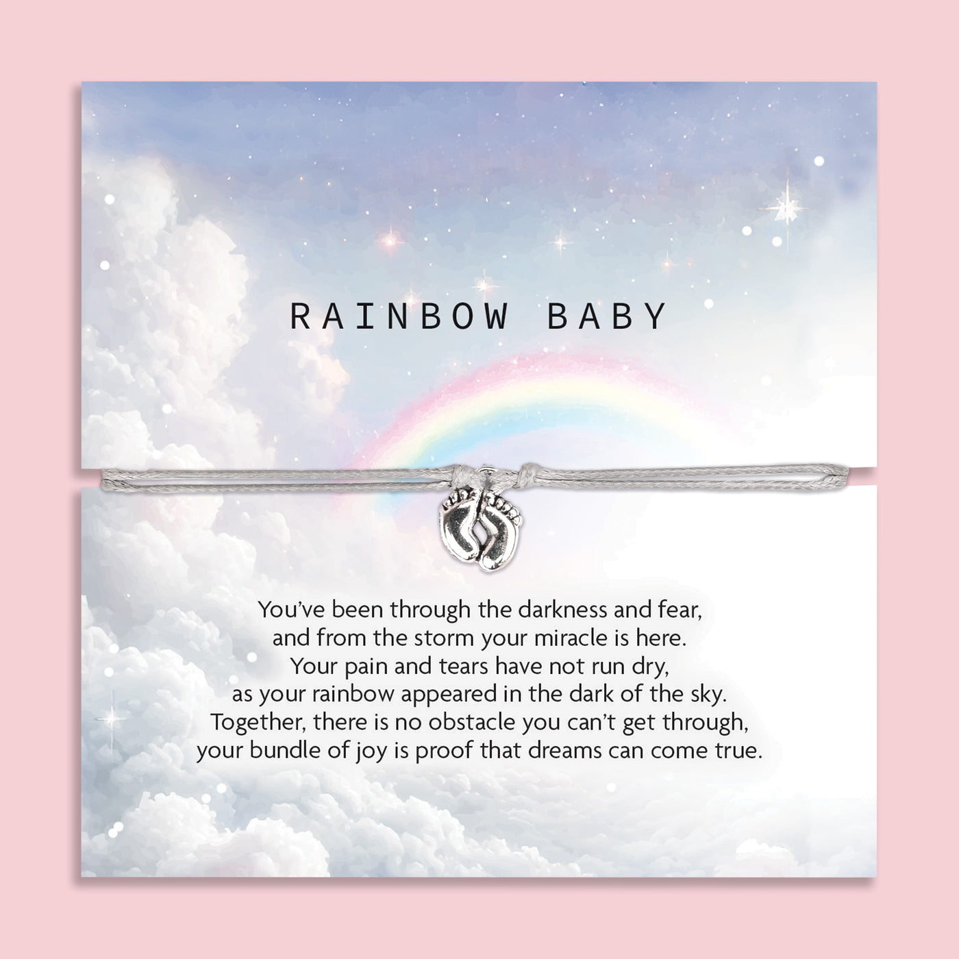 An image of a sentimental card featuring a silver bracelet with a small charm of intertwined hands. The card has a soft, dreamy design with a cloudy sky and a rainbow in the background. The text on the card reads 