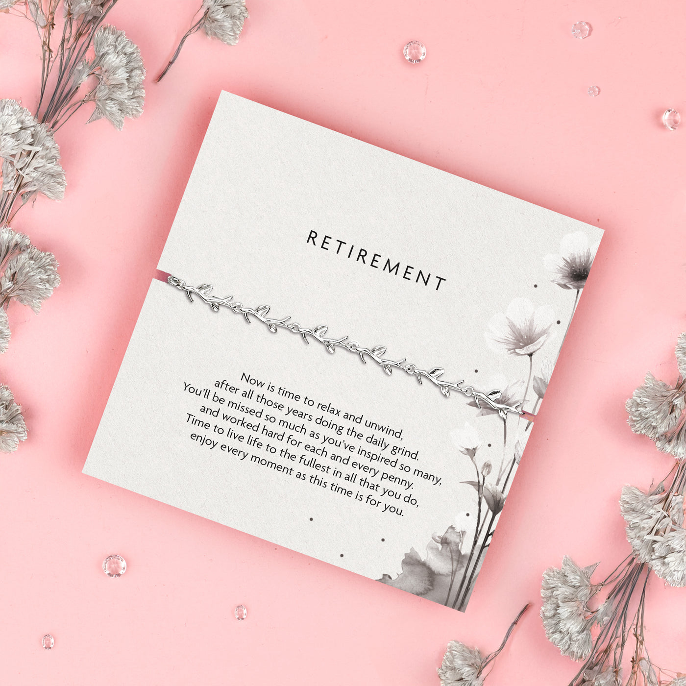 Silver leaf bracelet, a thoughtful gift for retirement. Presented on a 'Retirement' card featuring a heartfelt message celebrating years of hard work and dedication. Perfect for someone retiring, this elegant bracelet symbolizes relaxation, new beginnings, and enjoying life's next chapter.