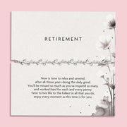 Retirement poem card with floral design and text on a pink background. Silver-plated elegant bracelet under £20 for a friend or colleagues retirement