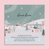 Secret Santa card with a winter village scene and festive text on a pink background, with a beautiful christmas wreath on a friendship bracelet