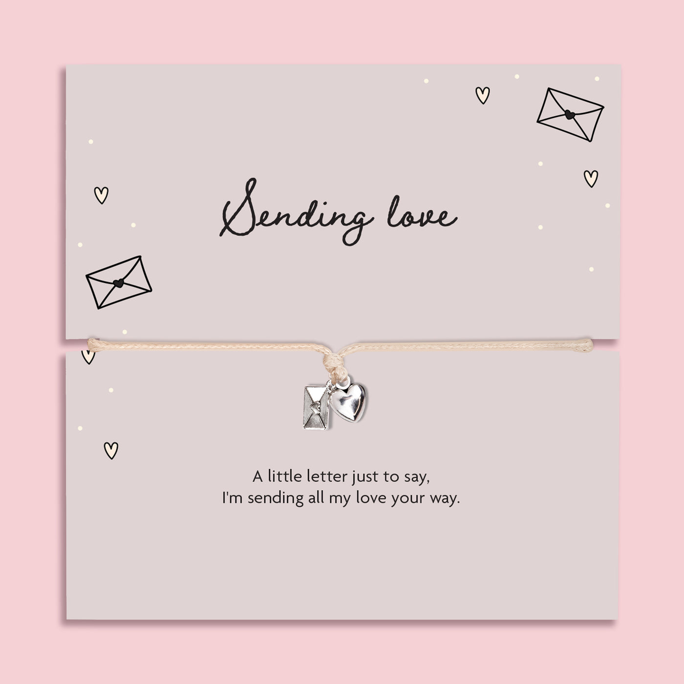 A pink background with 'sending love' poem card and heart envelope charm bracelet.