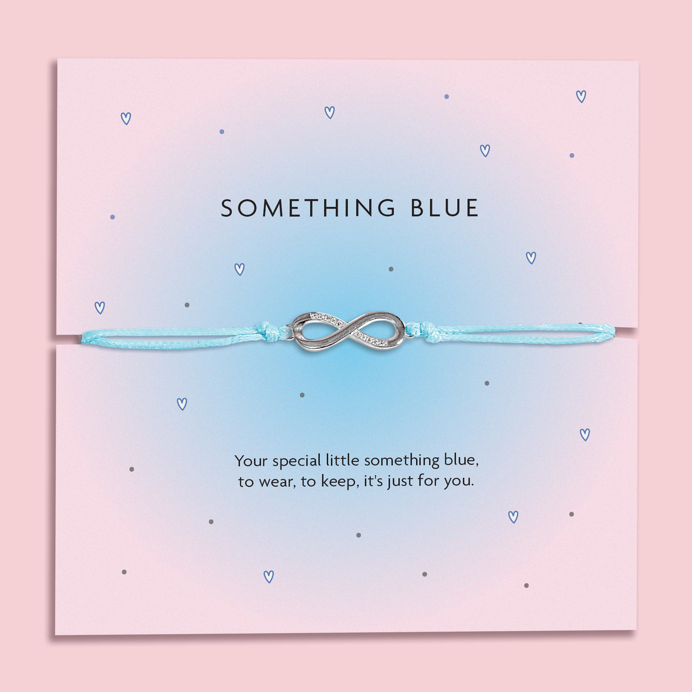Something Blue wedding bracelet with silver-plated star charm and cubic zirconia on pale blue cord, displayed on a pink poem card.