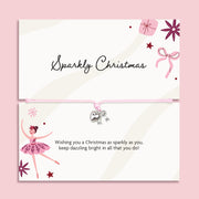 A Christmas-themed card set with a matching adjustable bracelet. The top card reads 'Sparkly Christmas' with illustrations of a gift box, bow, and stars.