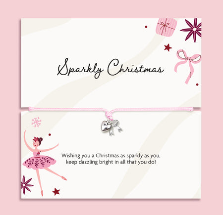 A Christmas-themed card set with a matching adjustable bracelet. The top card reads 'Sparkly Christmas' with illustrations of a gift box, bow, and stars.