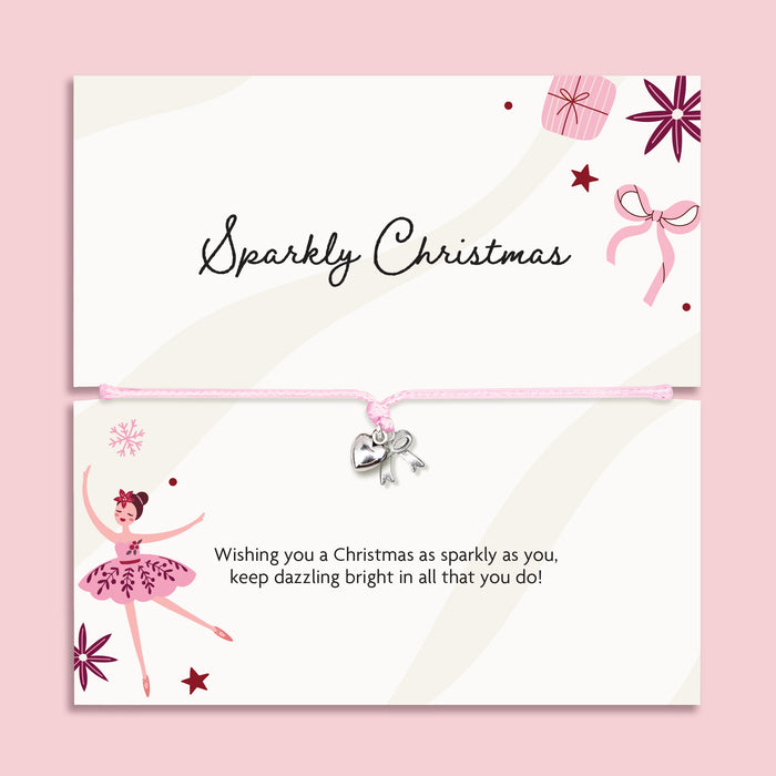 A Christmas-themed card set with a matching adjustable bracelet. The top card reads 'Sparkly Christmas' with illustrations of a gift box, bow, and stars.