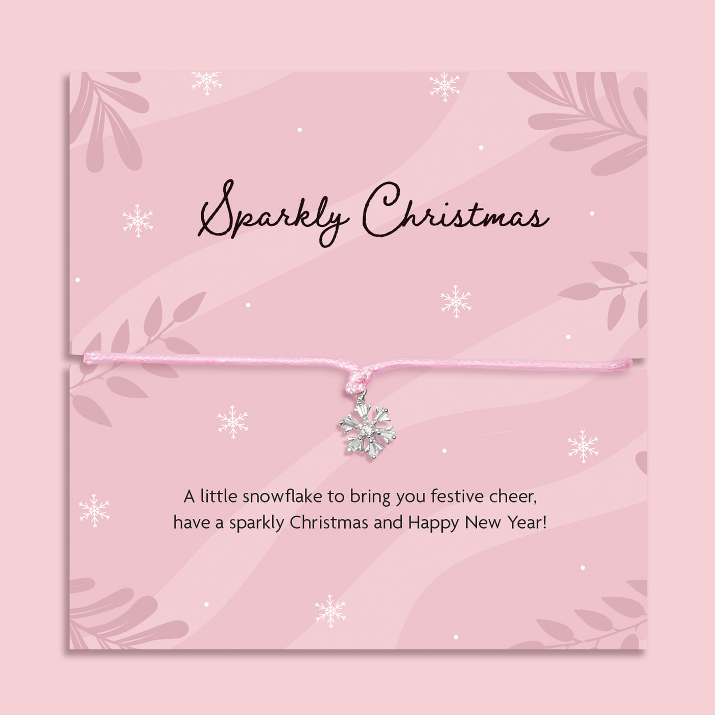 Delicate silver snowflake charm bracelet on a pink cord, displayed on a pink “Sparkly Christmas” poem card with festive snowflake design, thoughtful Christmas gift for her by Letterbox Love.