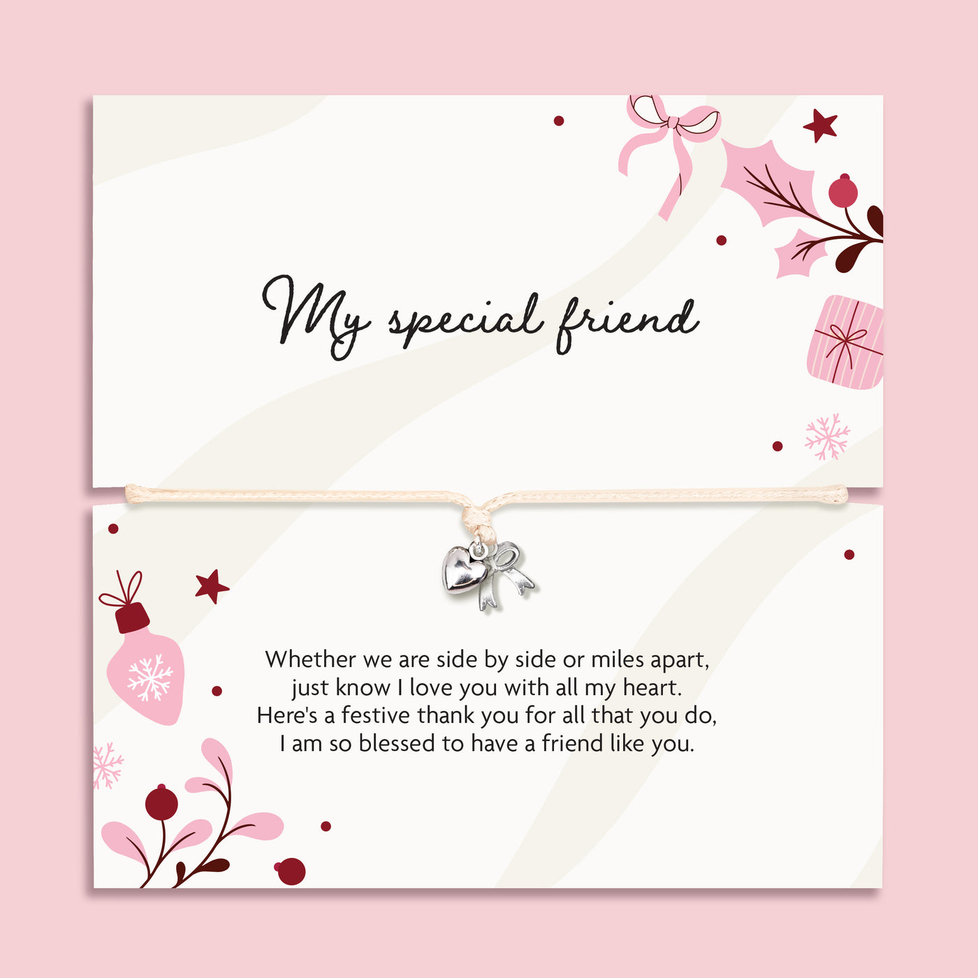 A friendship bracelet featuring a cream card with elegant black script reading 'My special friend' and a matching poem on the bottom, with a bracelet with a small silver heart charm and bow. The cards are decorated with pink and burgundy floral illustrations, set against a solid pink background.