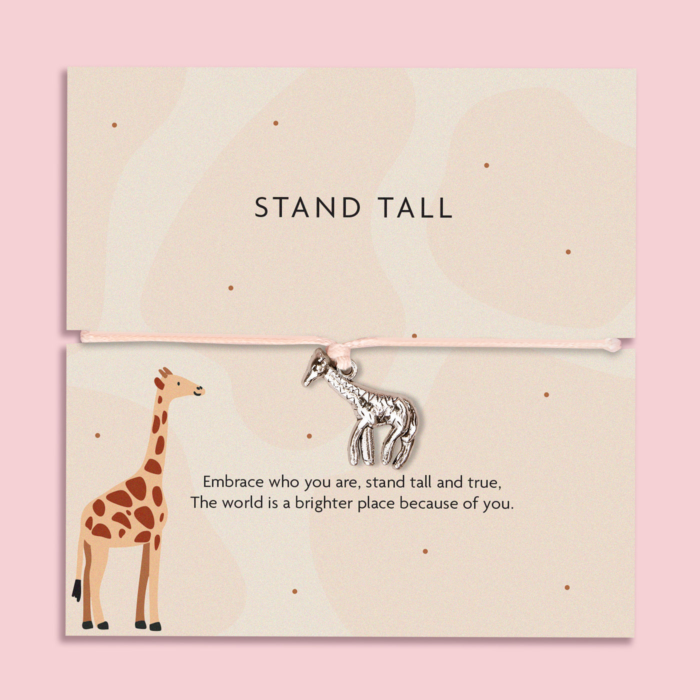 A silver giraffe charm on a beige adjustable cord, accompanied by a sentiment card reading, 