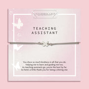 Pale pink "teaching assistant" thank you care with a subtle grey friendship bracelet with a cute butterfly charm. A beautiful gift to say thank you to a teacher under £10