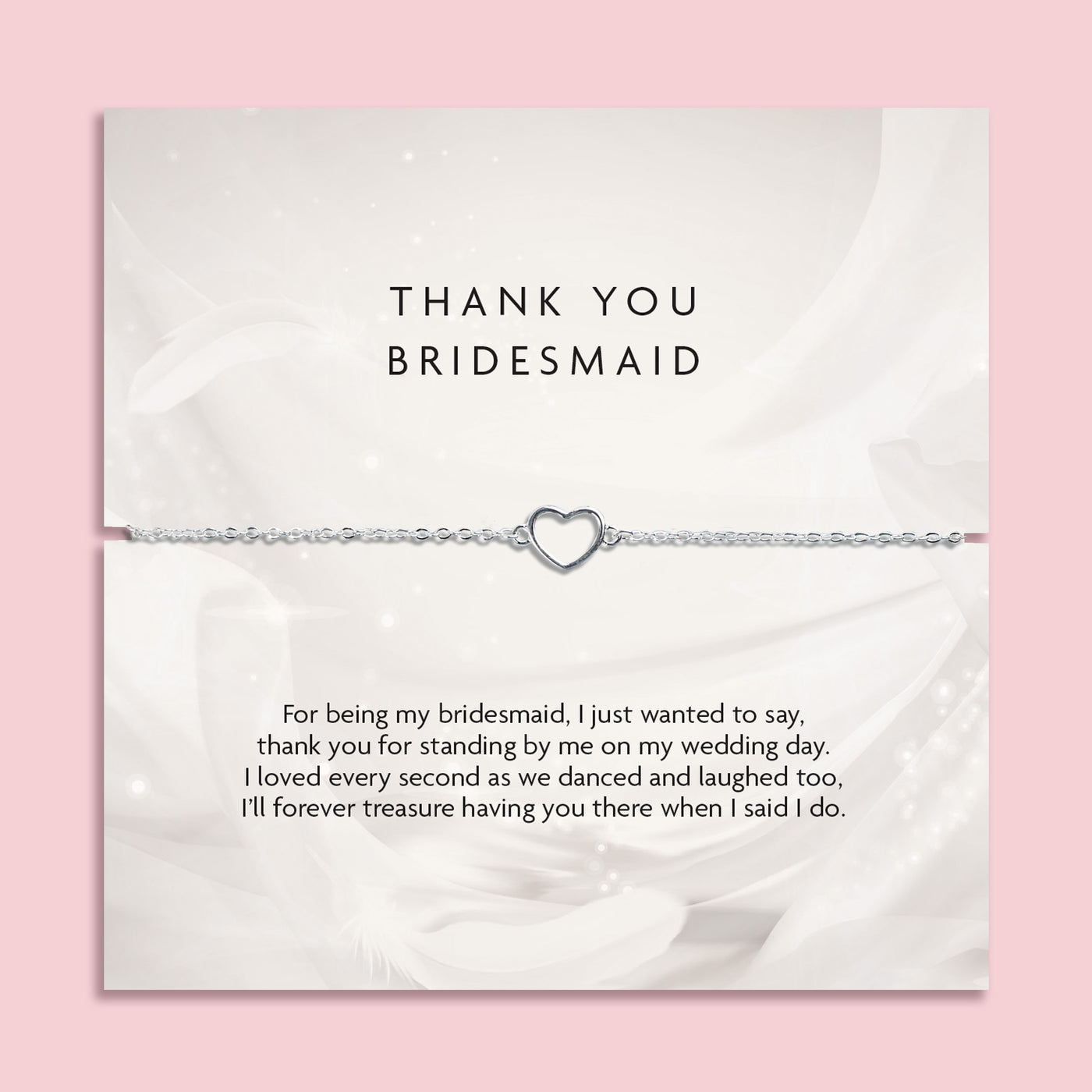 Silver bracelet with heart charm on a thank you card for a bridesmaid, on a pink background. A meaningful gift for a bridal party, silver jewellery to say thank you to a bridesmaid.
