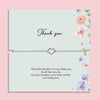 Delicate silver heart charm bracelet displayed on a pastel floral thank you card with the message “This little bracelet is to say thank you for all that you do.” Meaningful thank you gift for friends, teachers, bridesmaids or loved ones.