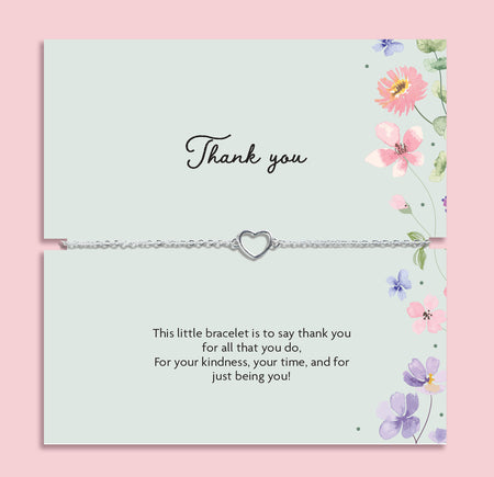 Delicate silver heart charm bracelet displayed on a pastel floral thank you card with the message “This little bracelet is to say thank you for all that you do.” Meaningful thank you gift for friends, teachers, bridesmaids or loved ones.