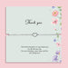 Delicate silver heart charm bracelet displayed on a pastel floral thank you card with the message “This little bracelet is to say thank you for all that you do.” Meaningful thank you gift for friends, teachers, bridesmaids or loved ones.