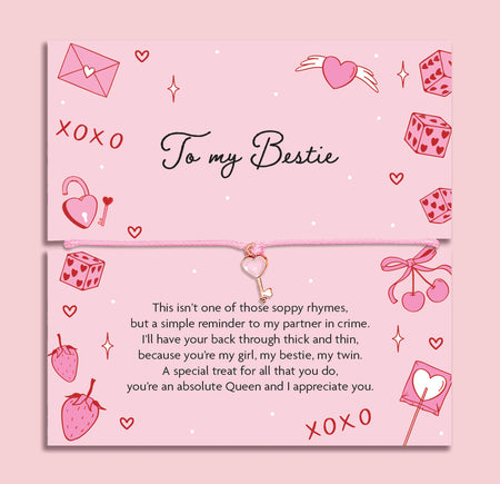 Poem card with decorative elements and text about friendship on a pink background. The Bracelet is a pink key friendship bracelet