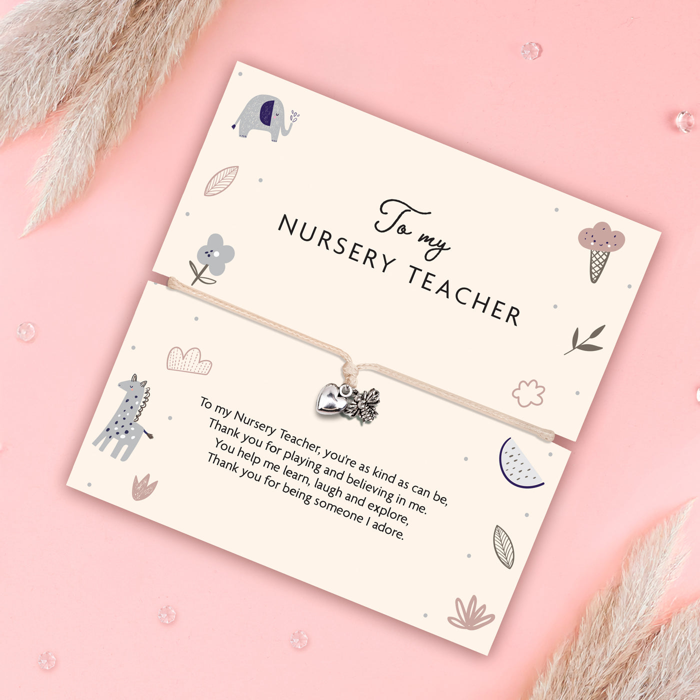 Card with a bracelet for a nursery teacher on a pink background