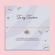 To my teacher bracelet with book charm on adjustable cord displayed on thank you message card, teacher appreciation gift