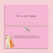 "To a Cat Mum" bracelet with a silver-tone fishbone charm on a beige cord, accompanied by a pink card with a cat illustration and a heartfelt sentiment.