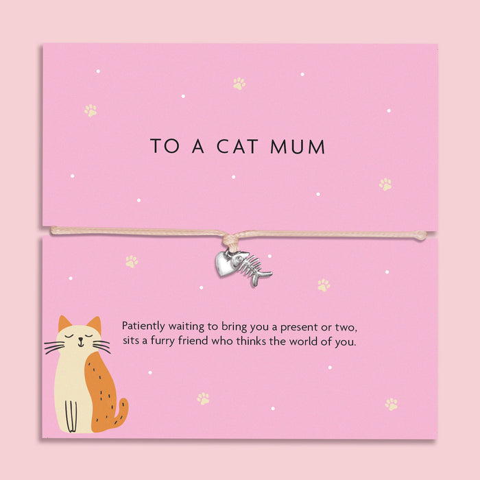 "To a Cat Mum" bracelet with a silver-tone fishbone charm on a beige cord, accompanied by a pink card with a cat illustration and a heartfelt sentiment.