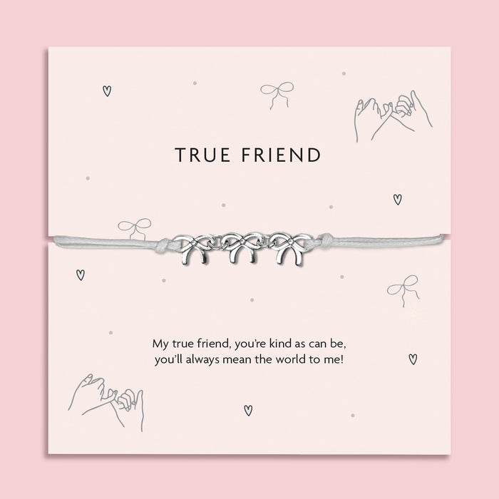 Silver Bows charm bracelet on a pastel pink card with the message "True Friend";  a thoughtful friendship gift for women featuring an adjustable cord and heartfelt poem.