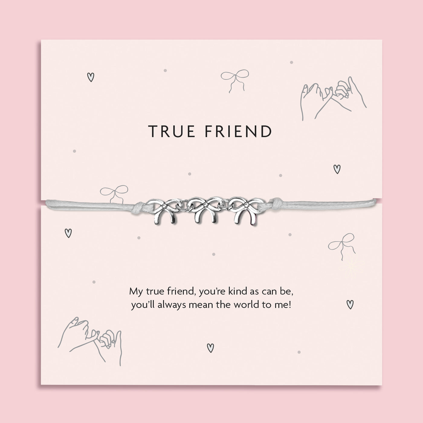 Silver Bows charm bracelet on a pastel pink card with the message 