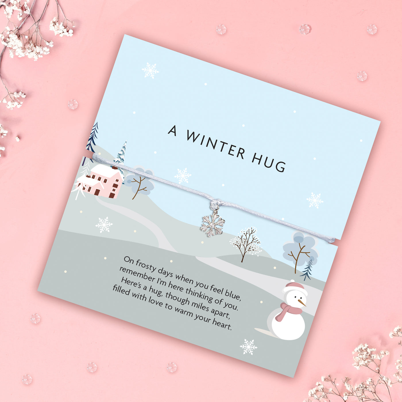 Festive poem card with winter scene and text on a pink background