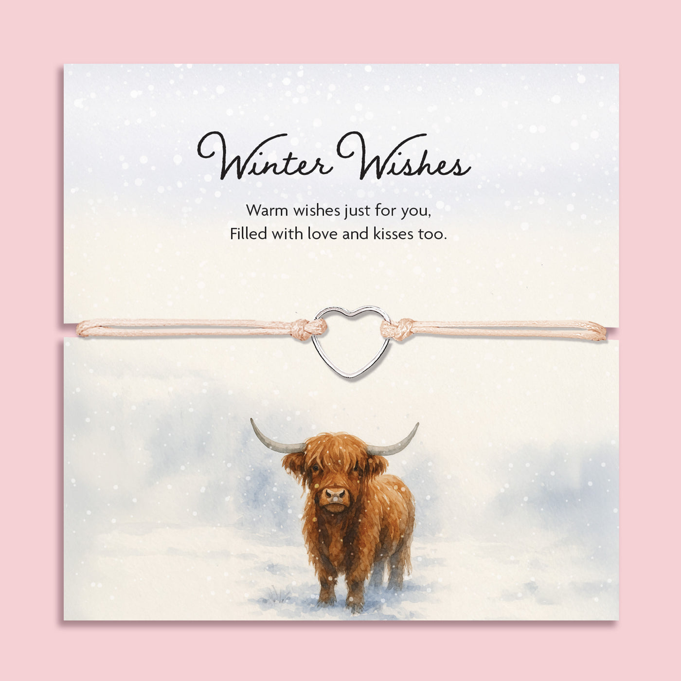 Beige cord bracelet with a silver-tone heart charm, displayed on a winter-themed card featuring a Highland cow in a snowy scene, with the words 'Winter Wishes – Warm wishes just for you, filled with love and kisses too'.