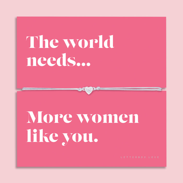 Friendship bracelet with a silver heart charm on an adjustable cord, displayed on a pink card reading “The world needs… more women like you” — an empowering bracelet for a friend and thoughtful friendship gift by Letterbox Love.