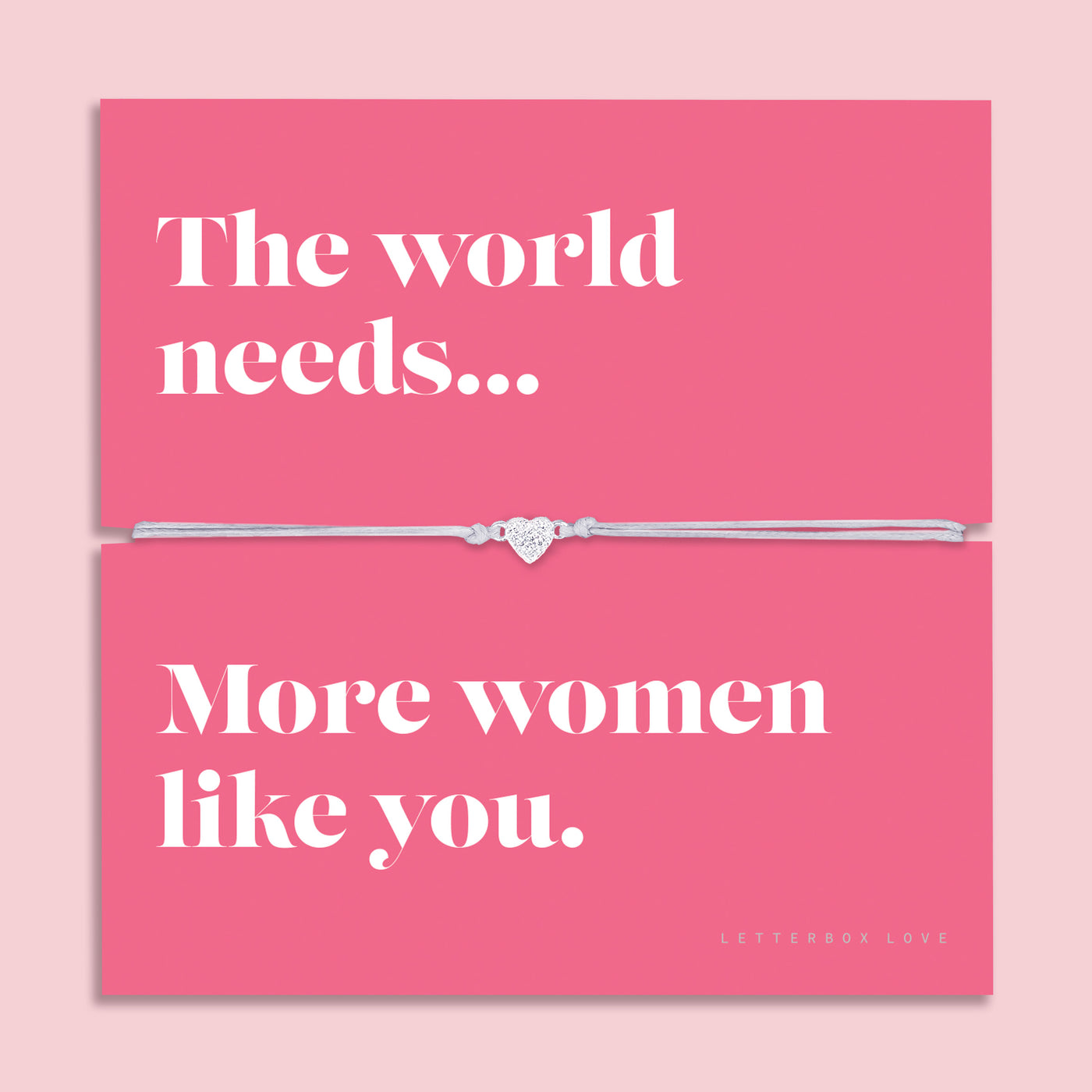 Friendship bracelet with a silver heart charm on an adjustable cord, displayed on a pink card reading “The world needs… more women like you” — an empowering bracelet for a friend and thoughtful friendship gift by Letterbox Love.