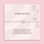 Silver heart charm bracelet on delicate chain displayed on “Work Bestie” message card with office illustrations, coworker friendship gift jewellery.