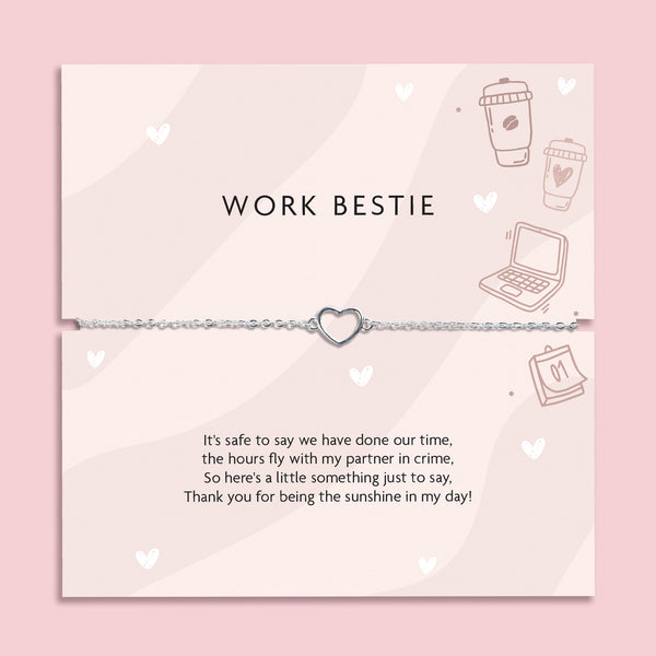 Silver heart charm bracelet on delicate chain displayed on “Work Bestie” message card with office illustrations, coworker friendship gift jewellery.