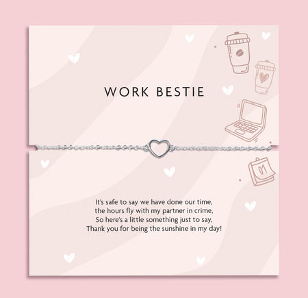 Silver heart charm bracelet on delicate chain displayed on “Work Bestie” message card with office illustrations, coworker friendship gift jewellery.